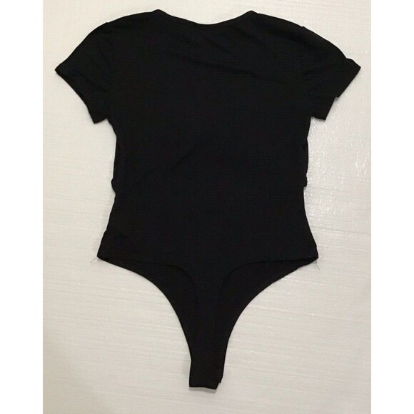 Say Anything Top Solid Black Thong Bodysuit Medium Peek a Boo Mid Section PREOWN - Picture 2 of 4